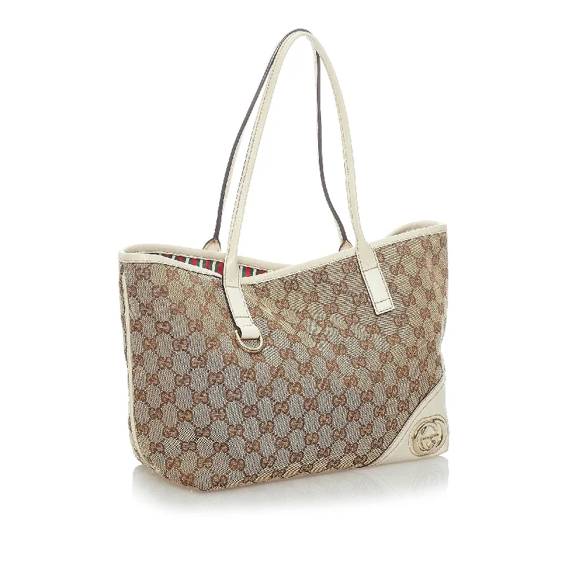 Women Gucci bags with a snap - button closure and a decorative charmGucci GG Canvas New Britt Tote Bag (33501)