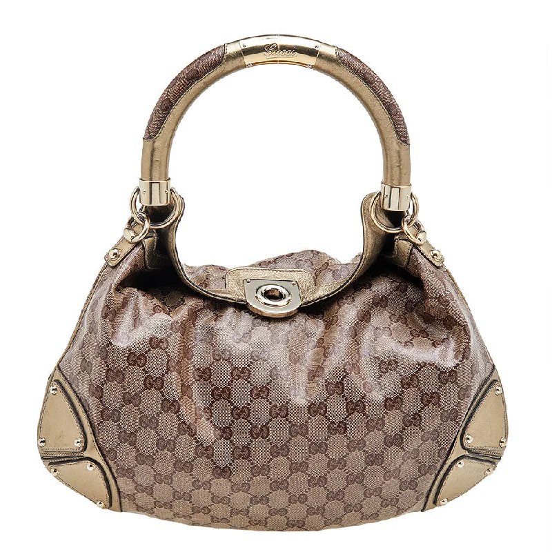 Women Gucci Sylvie bags featuring the signature web stripeGucci Beige/Gold GG Crystal Canvas and Leather Medium Babouska Indy Hobo