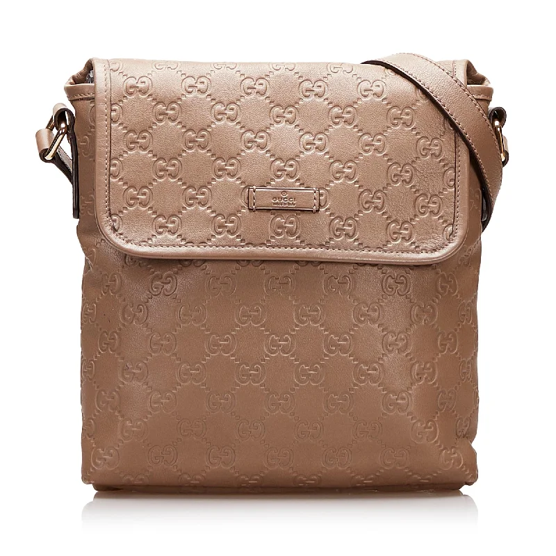 Women Gucci bags with a snap - button closure and a decorative charmGucci Guccissima Crossbody