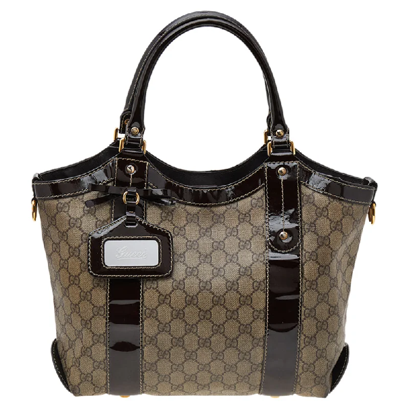 Women Gucci Sylvie bags with a detachable ribbon detailGucci Beige/Brown GG Supreme Coated Canvas And Patent Leather Bow Mirror Sukey Tote