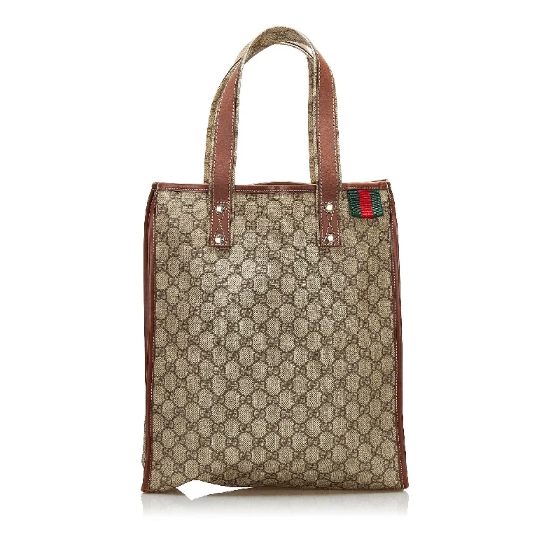 Ladies Gucci shoulder bags with a tassel decorationGucci GG Supreme Web Loop  Tote